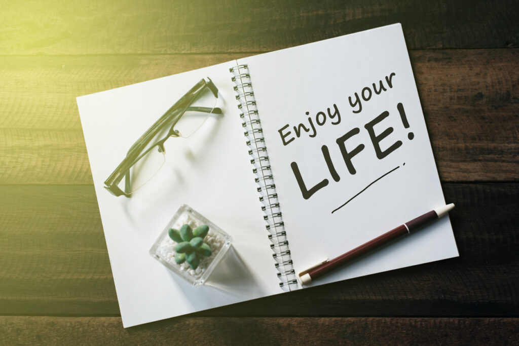 An open notebook with the first sobriety goal to “Enjoy your life”