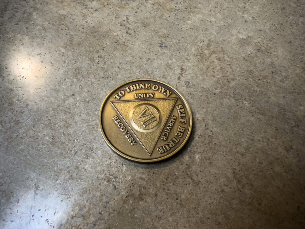 AA sobriety chip symbolizing Outpatient Alcohol Detox recovery milestone