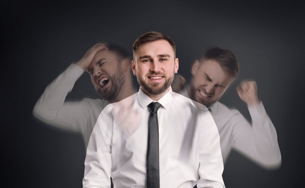 Borderline Personality Disorder vs Bipolar: Are You Getting the Right Treatment for Your Recovery? man,with,personality,disorder,on,dark,background,,multiple,exposure